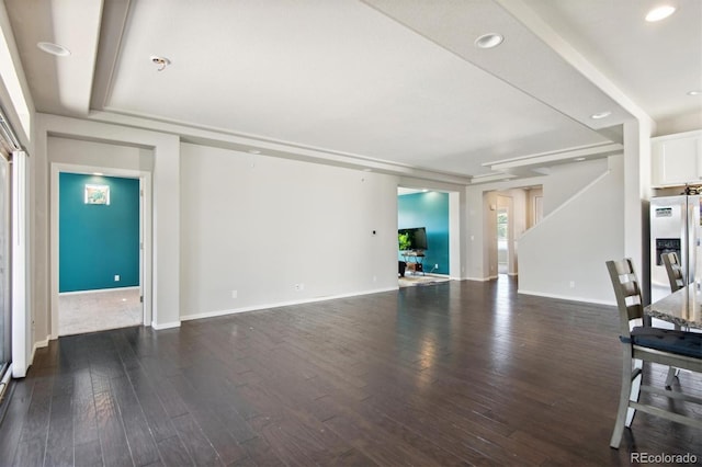 unfurnished living room with dark hardwood / wood-style floors