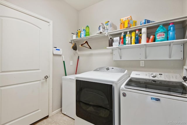 laundry room with separate washer and dryer