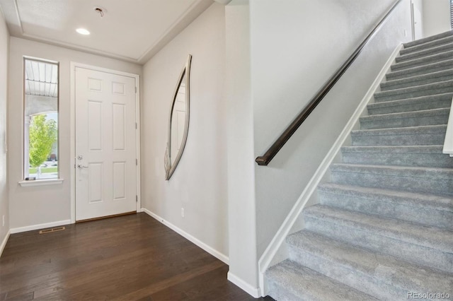 entrance foyer featuring recessed lighting, visible vents, wood finished floors, baseboards, and stairs