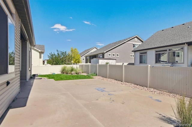 view of patio with a fenced backyard and a residential view