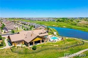 birds eye view of property featuring a water view and a residential view