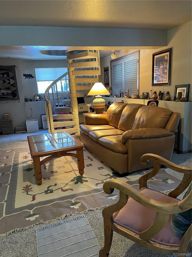 carpeted living room with a textured ceiling