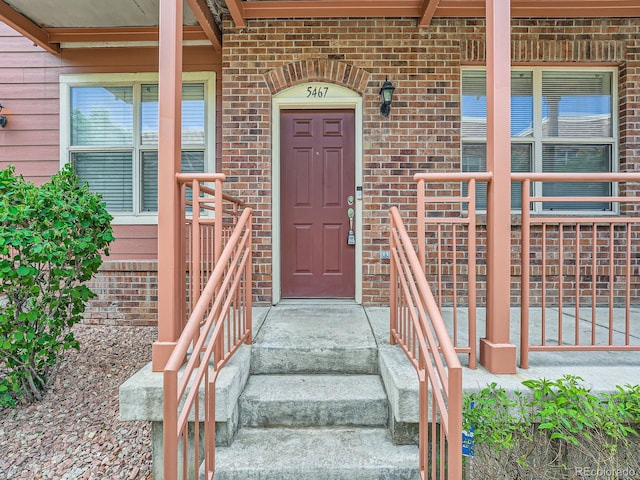 5467 Zephyr Ct Unit 5467, Arvada, CO 80002 - view of exterior entry featuring brick siding