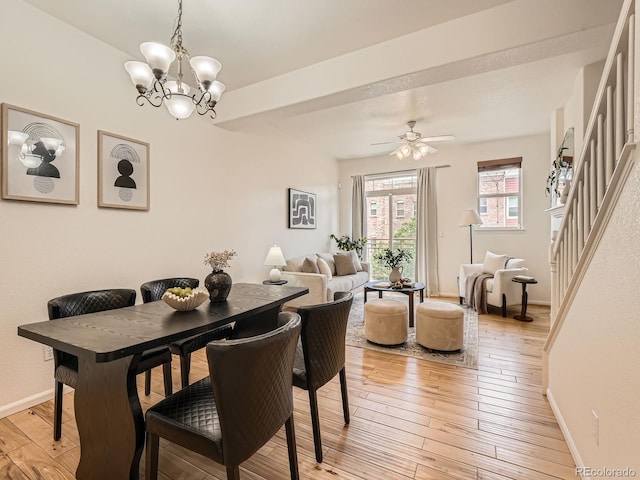 5467 Zephyr Ct Unit 5467, Arvada, CO 80002 - dining room featuring baseboards, light wood finished floors, a chandelier, and a ceiling fan