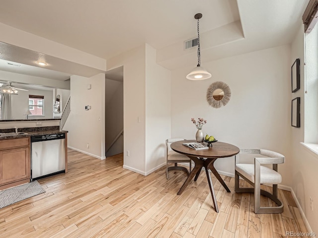 5467 Zephyr Ct Unit 5467, Arvada, CO 80002 - kitchen with stainless steel dishwasher, light wood-type flooring, and baseboards
