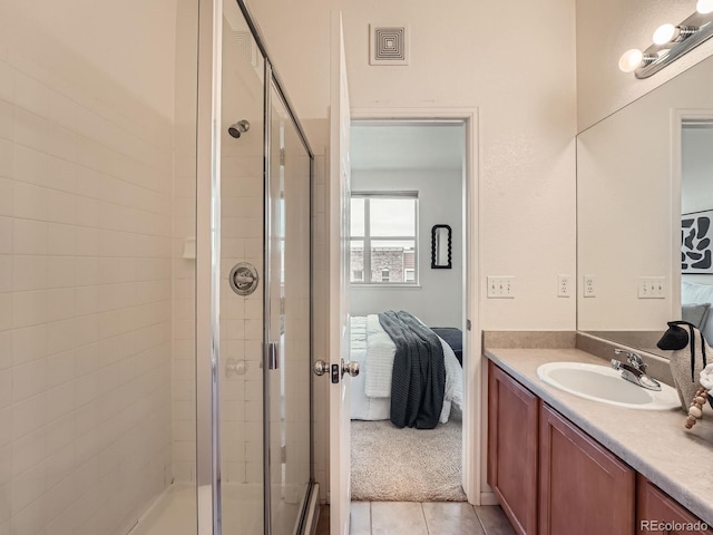 5467 Zephyr Ct Unit 5467, Arvada, CO 80002 - full bathroom featuring connected bathroom, a shower stall, vanity, and tile patterned floors