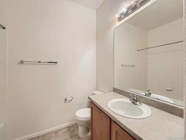 5467 Zephyr Ct Unit 5467, Arvada, CO 80002 - full bath with toilet, vanity, tile patterned flooring, baseboards, and shower / bathtub combination