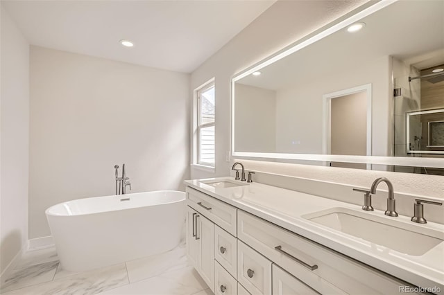15870 Duckweed Ct, Parker, CO 80134 - full bath featuring a sink, a freestanding tub, a stall shower, and recessed lighting