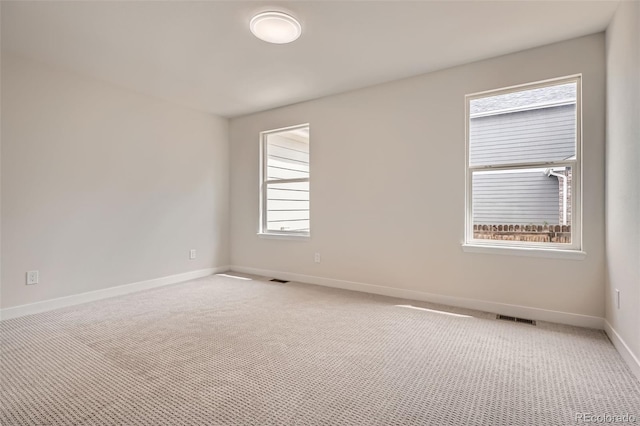 15870 Duckweed Ct, Parker, CO 80134 - empty room featuring baseboards, visible vents, and light carpet