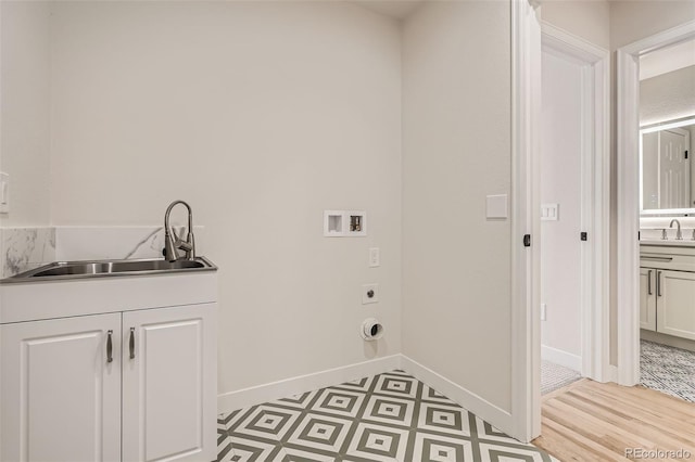 15870 Duckweed Ct, Parker, CO 80134 - laundry room with cabinet space, electric dryer hookup, a sink, and washer hookup