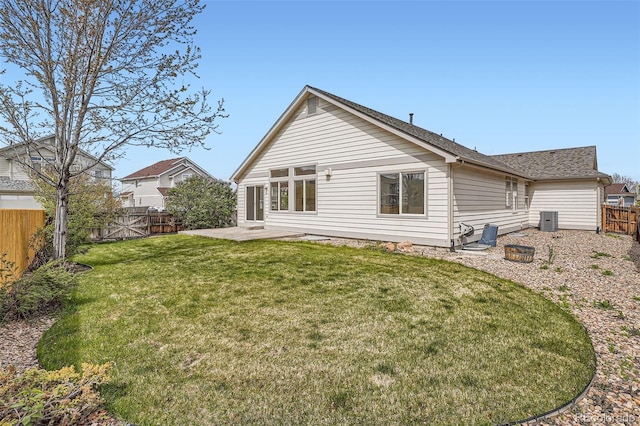 15870 Duckweed Ct, Parker, CO 80134 - back of property featuring roof with shingles, a fenced backyard, a patio area, central air condition unit, and a yard