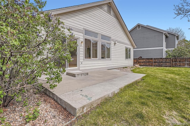 15870 Duckweed Ct, Parker, CO 80134 - rear view of house featuring a lawn, fence, and a patio area