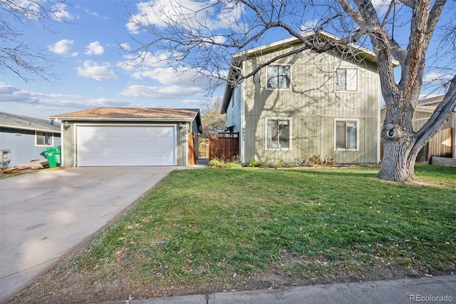 view of front property with an outbuilding, a front yard, and a garage