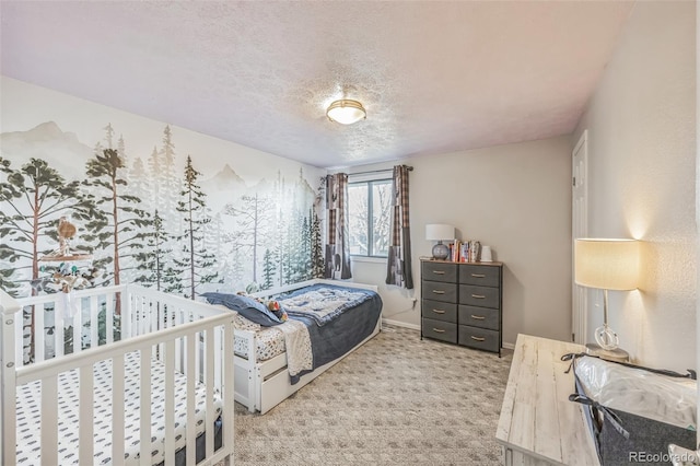 carpeted bedroom featuring a textured ceiling