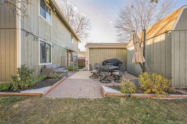 view of patio / terrace with a storage shed