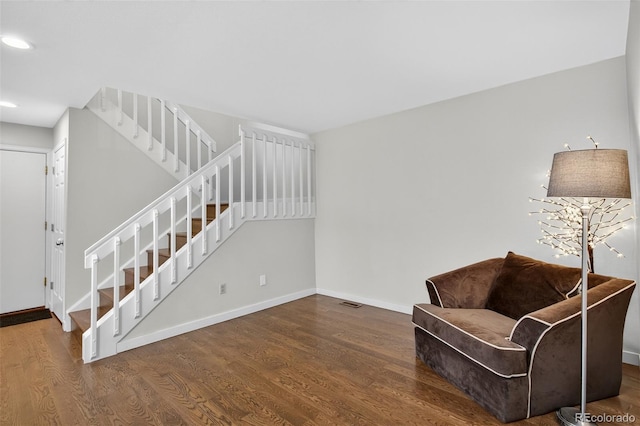 8269 S Gaylord Cir, Centennial, CO 80122 - sitting room with wood finished floors, recessed lighting, and stairway