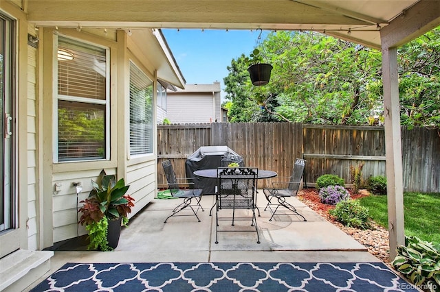 8269 S Gaylord Cir, Centennial, CO 80122 - fenced backyard featuring outdoor dining area and a patio area