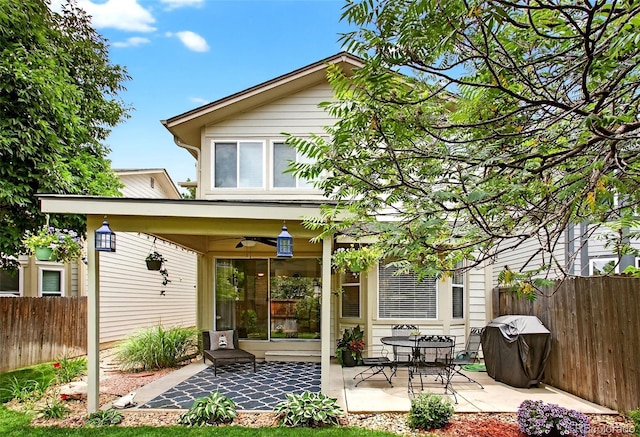 8269 S Gaylord Cir, Centennial, CO 80122 - back of property with ceiling fan and a patio area