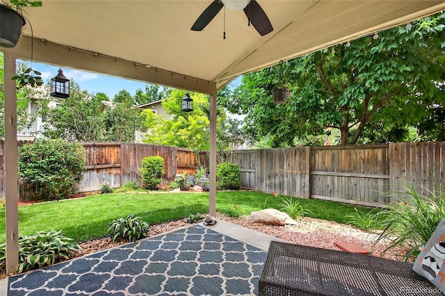 8269 S Gaylord Cir, Centennial, CO 80122 - fenced backyard with a ceiling fan and a patio