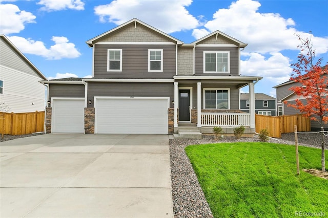 craftsman-style house featuring a front lawn, a garage, and a porch