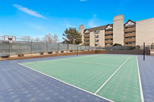 view of sport court with community basketball court and fence