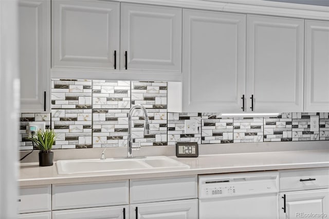kitchen featuring white cabinetry, a sink, and dishwasher