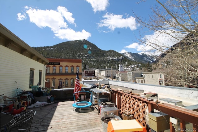 wooden deck with a mountain view