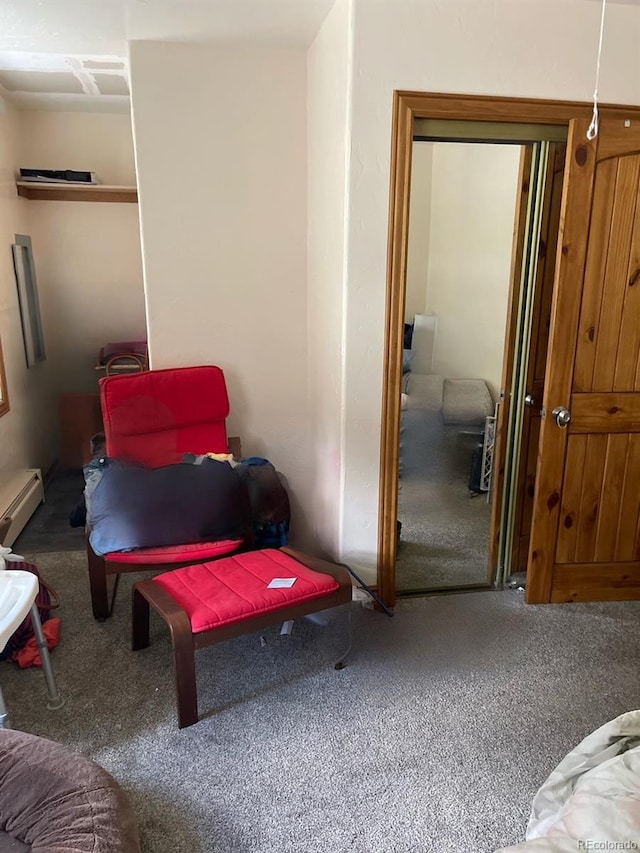 sitting room featuring carpet floors and a baseboard radiator