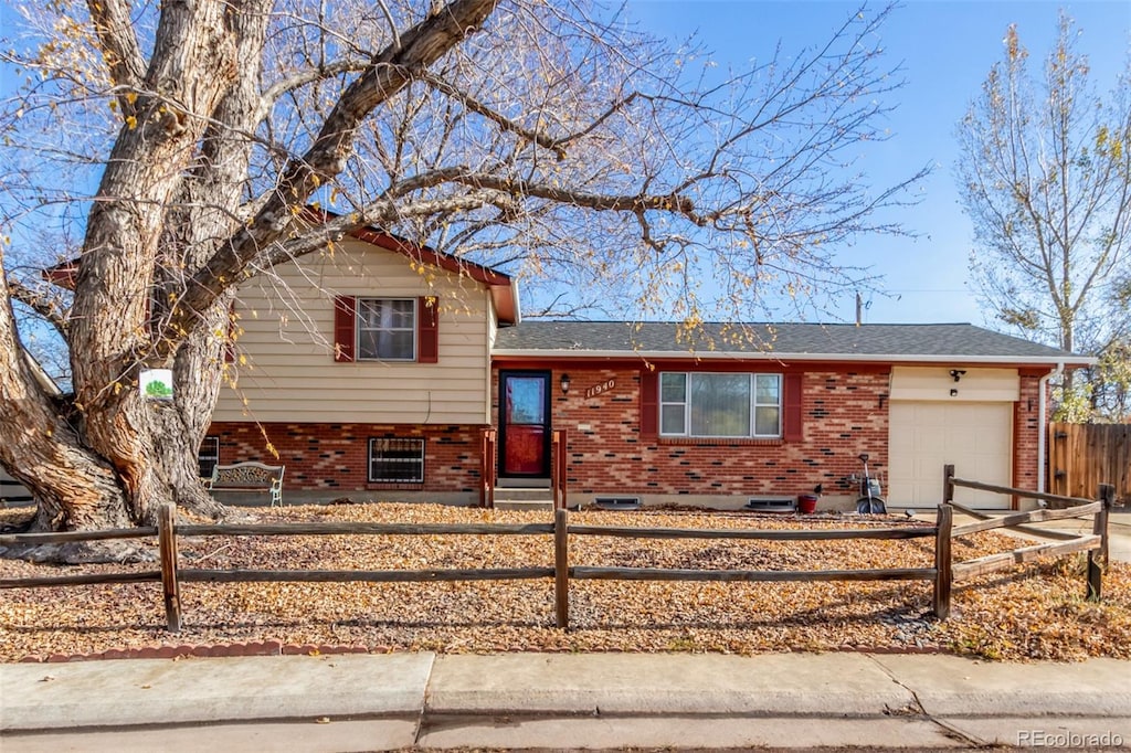 split level home featuring a garage