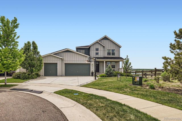4526 Colorado River Dr, Firestone, CO 80504 - view of front facade with a garage, board and batten siding, and concrete driveway