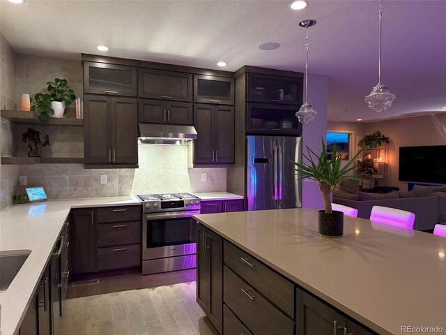 4526 Colorado River Dr, Firestone, CO 80504 - kitchen featuring stainless steel appliances, under cabinet range hood, open shelves, light countertops, and recessed lighting