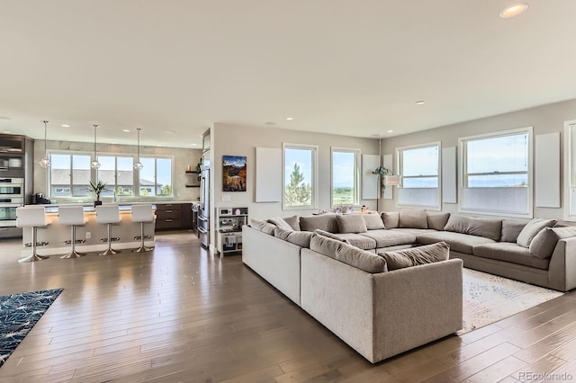 4526 Colorado River Dr, Firestone, CO 80504 - living area with recessed lighting and dark wood-style flooring