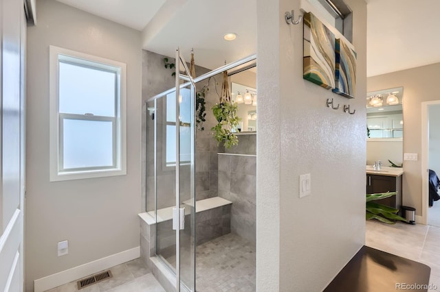 4526 Colorado River Dr, Firestone, CO 80504 - full bath featuring a shower stall, vanity, tile patterned floors, and baseboards