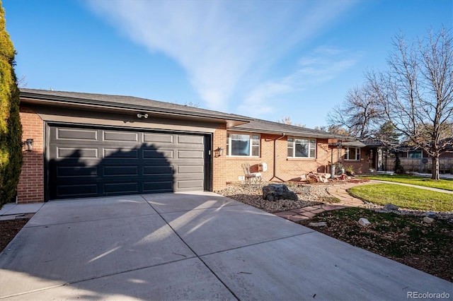 ranch-style house featuring a garage