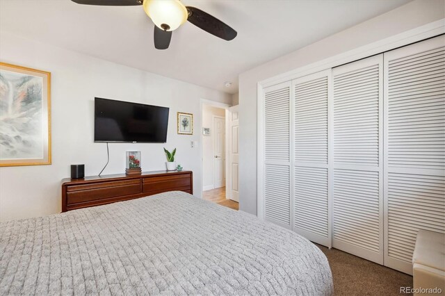 bedroom with ceiling fan, a closet, and carpet