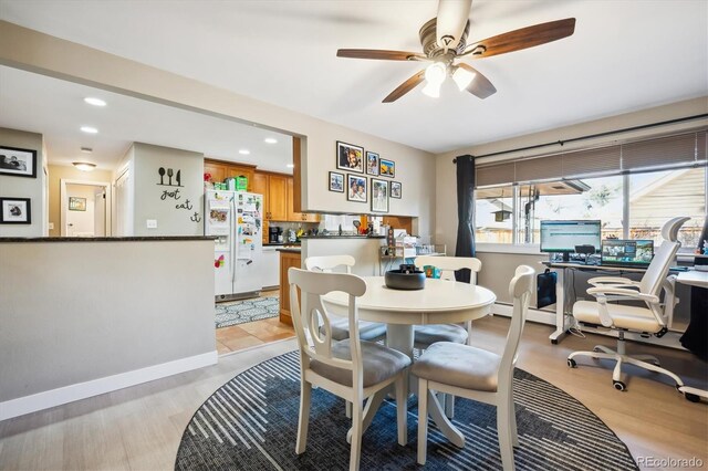 dining room featuring ceiling fan and light hardwood / wood-style floors