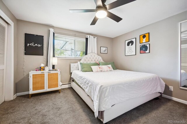 bedroom with carpet, ceiling fan, baseboard heating, and a closet