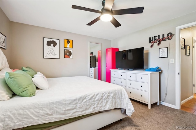 bedroom with ceiling fan and light colored carpet