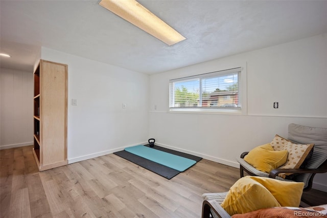 7118 Metropolitan St, Colorado Springs, CO 80911 - living area featuring baseboards and light wood-type flooring