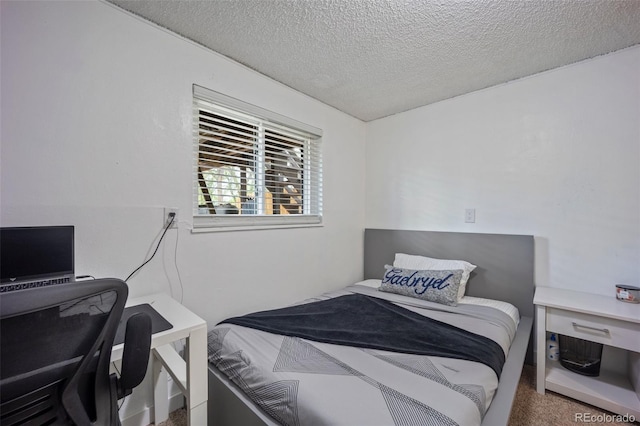 7118 Metropolitan St, Colorado Springs, CO 80911 - carpeted bedroom featuring a textured ceiling