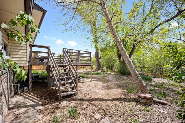 7118 Metropolitan St, Colorado Springs, CO 80911 - view of yard featuring stairs, fence, and a deck