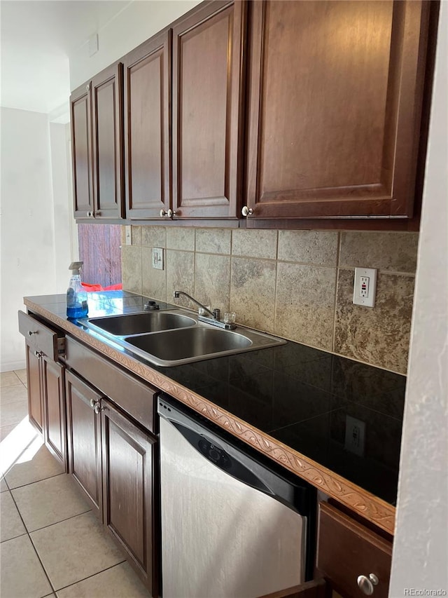 kitchen featuring decorative backsplash, stainless steel dishwasher, dark brown cabinetry, sink, and light tile patterned floors