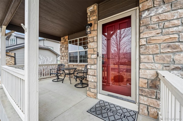 property entrance featuring covered porch