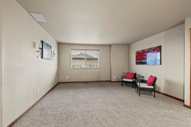 sitting room featuring carpet floors