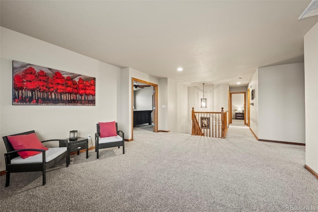 sitting room with carpet floors