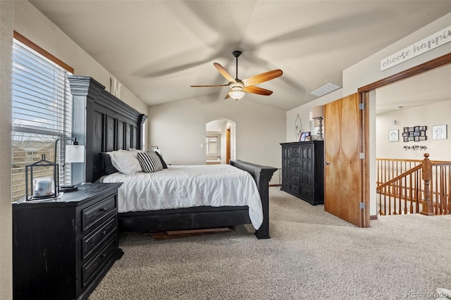 carpeted bedroom with ceiling fan and lofted ceiling