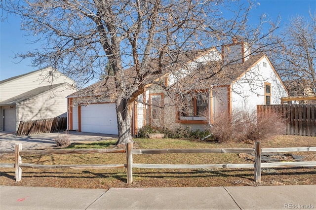 view of front of property with a garage