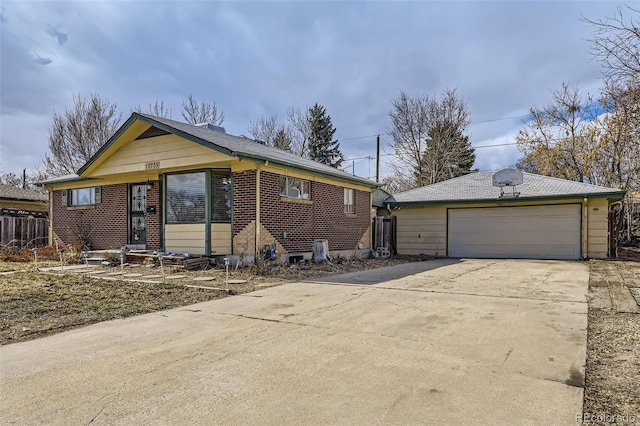 view of front of house featuring brick siding and an outdoor structure