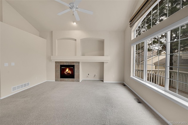 4042 E Hinsdale Cir, Centennial, CO 80122 - unfurnished living room featuring vaulted ceiling, a tile fireplace, carpet, baseboards, and ceiling fan