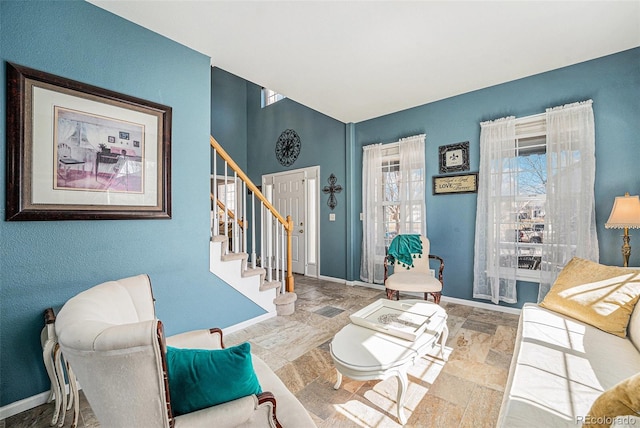 5224 Snow Goose St, Brighton, CO 80601 - living room with stone finish floor, stairs, and baseboards